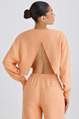 Textured Cotton Jersey Open-Back Cropped Sweatshirt in Peach